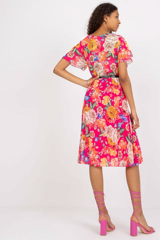 Summer floral dress with flared cut, envelope neckline, and pleated hem.