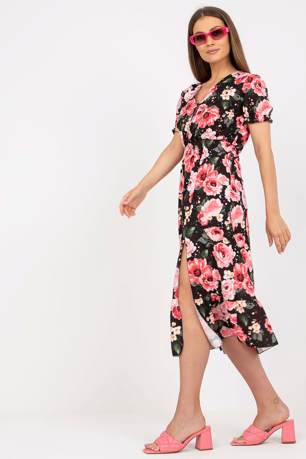 Women's summer floral dress with short sleeves, buttoned front, bottom slit, and frill.