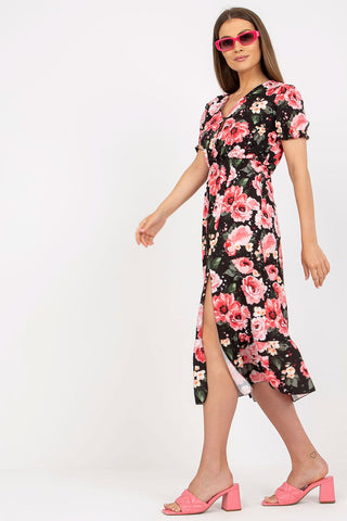 Women's summer floral dress with short sleeves, buttoned front, bottom slit, and frill.