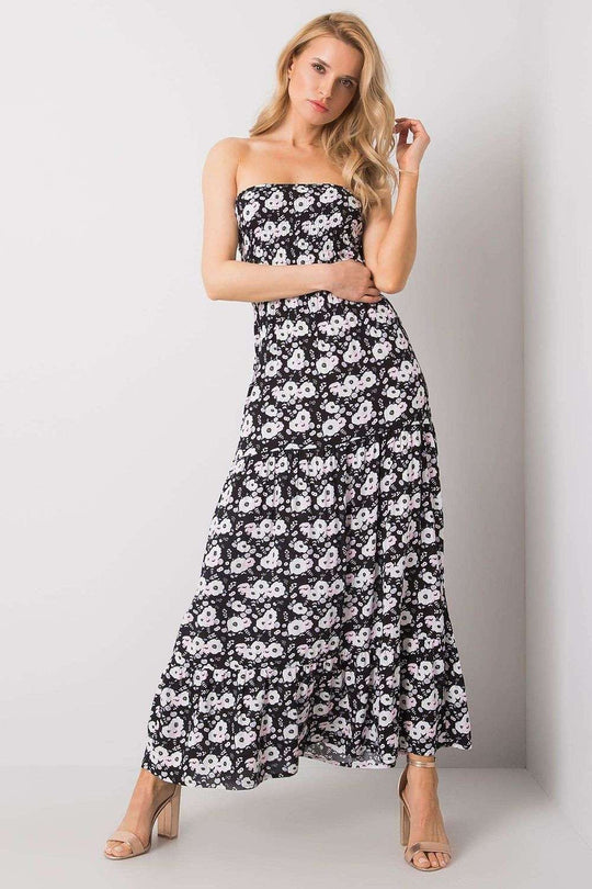 Long summer dress with floral pattern, strapless design, and ruffled bottom.