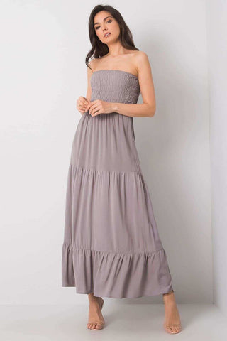 Long summer strapless dress with ruffle hem and elastic top.