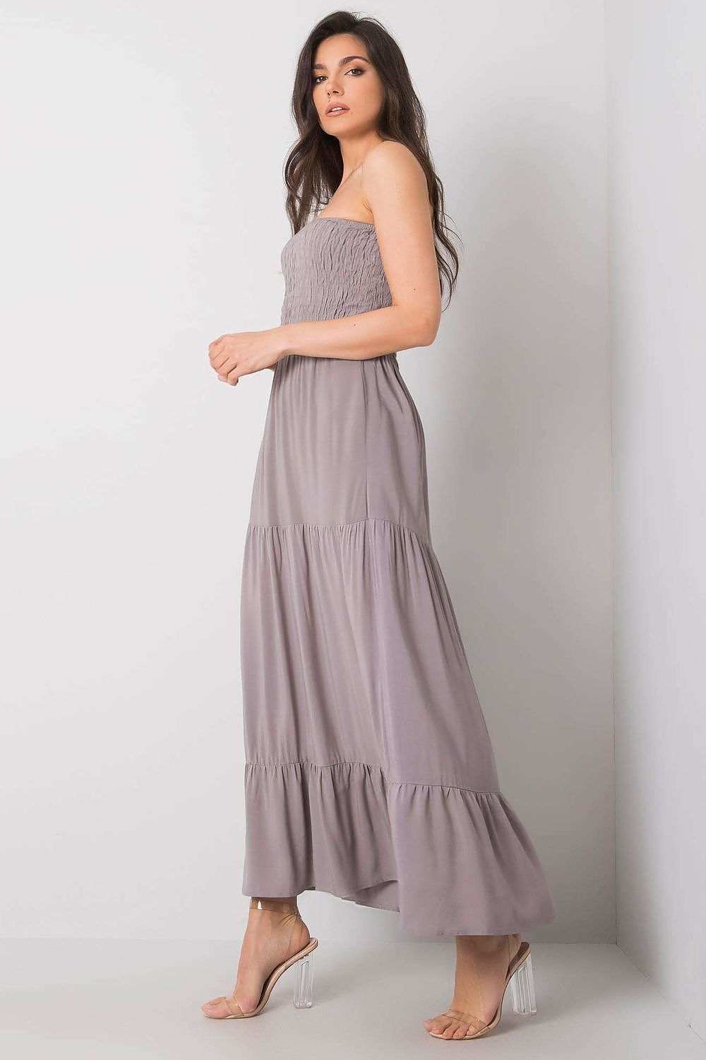 Strapless long summer dress with supportive elastic top and bottom ruffle, perfect for a breezy style.