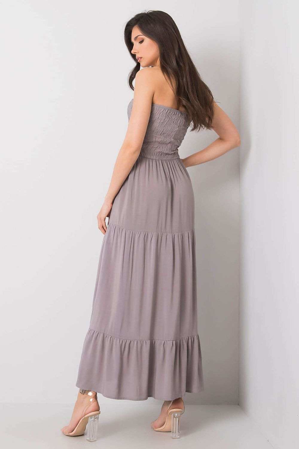 Long strapless summer dress with elastic top and ruffled bottom in light purple, perfect for warm weather.