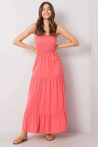 Long summer dress without straps, elastic top, and ruffled bottom for breezy comfort.