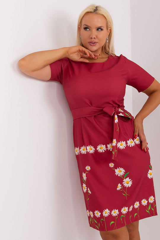 Plus size dress with floral print, short sleeves, round neckline, and waist tie.