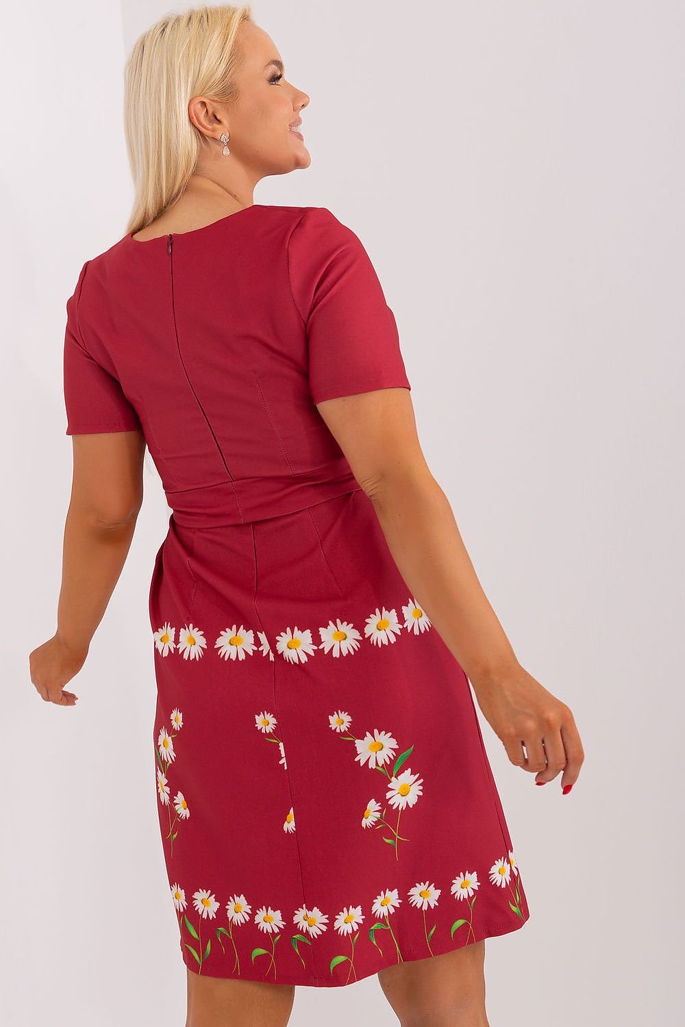 Plus size dress with floral print, short sleeves, and waist tie.