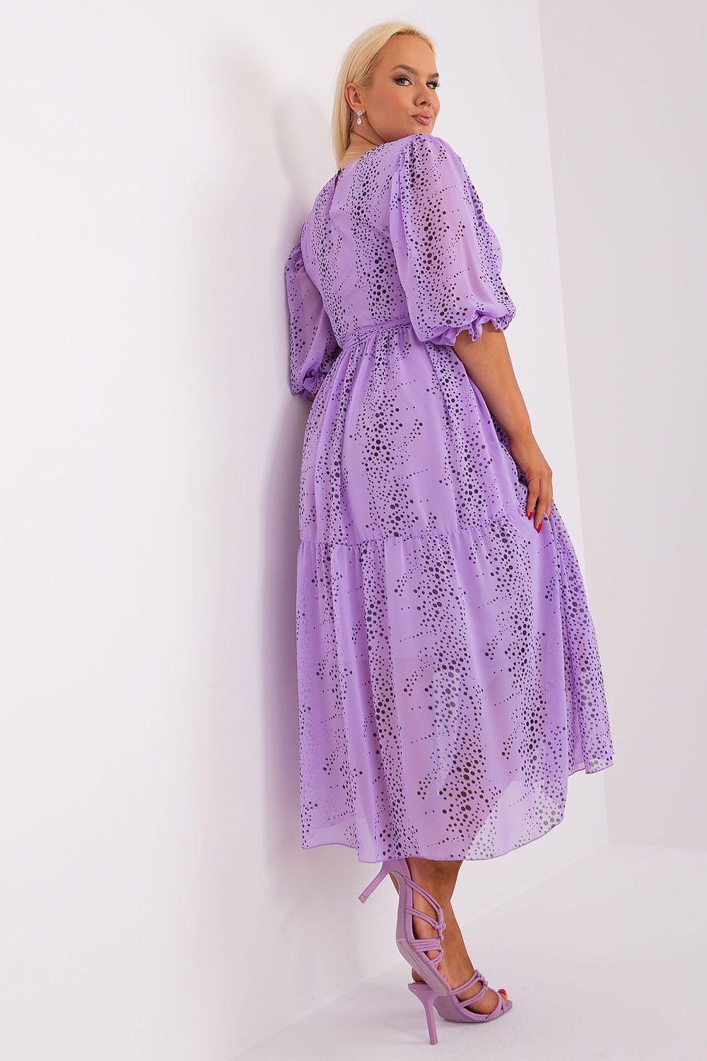 Plus size purple dress with 3/4 sleeves and tie waist.