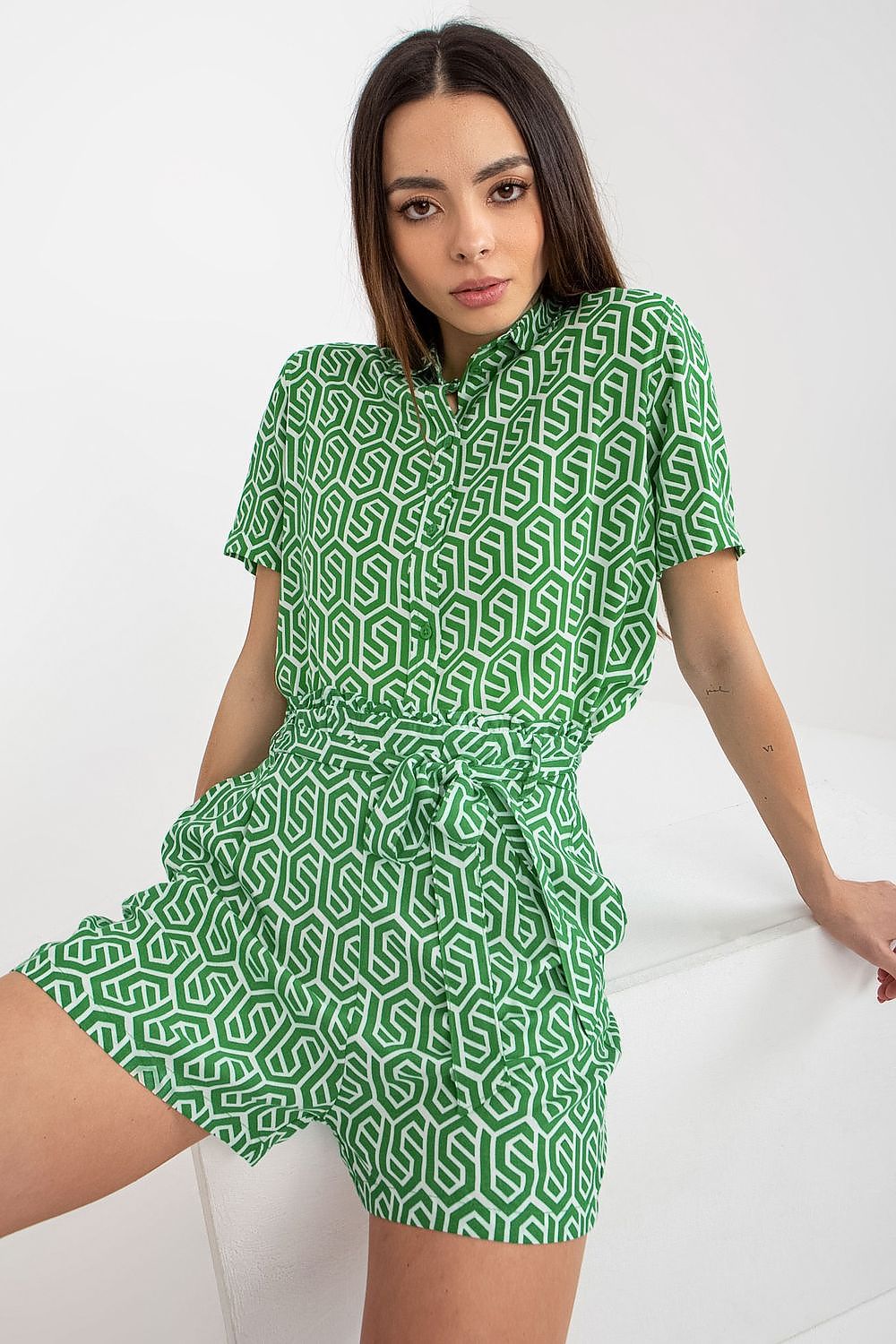 Women's high-waisted summer short with a tie waistband, side pockets, and green pattern.