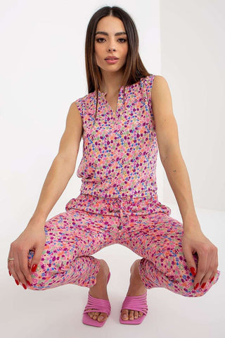 Sleeveless floral blouse with a heart neckline and colorful pattern.