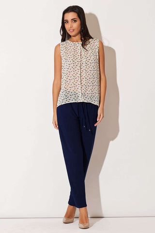 Chiffon blouse with bird pattern and sleeveless round neckline.